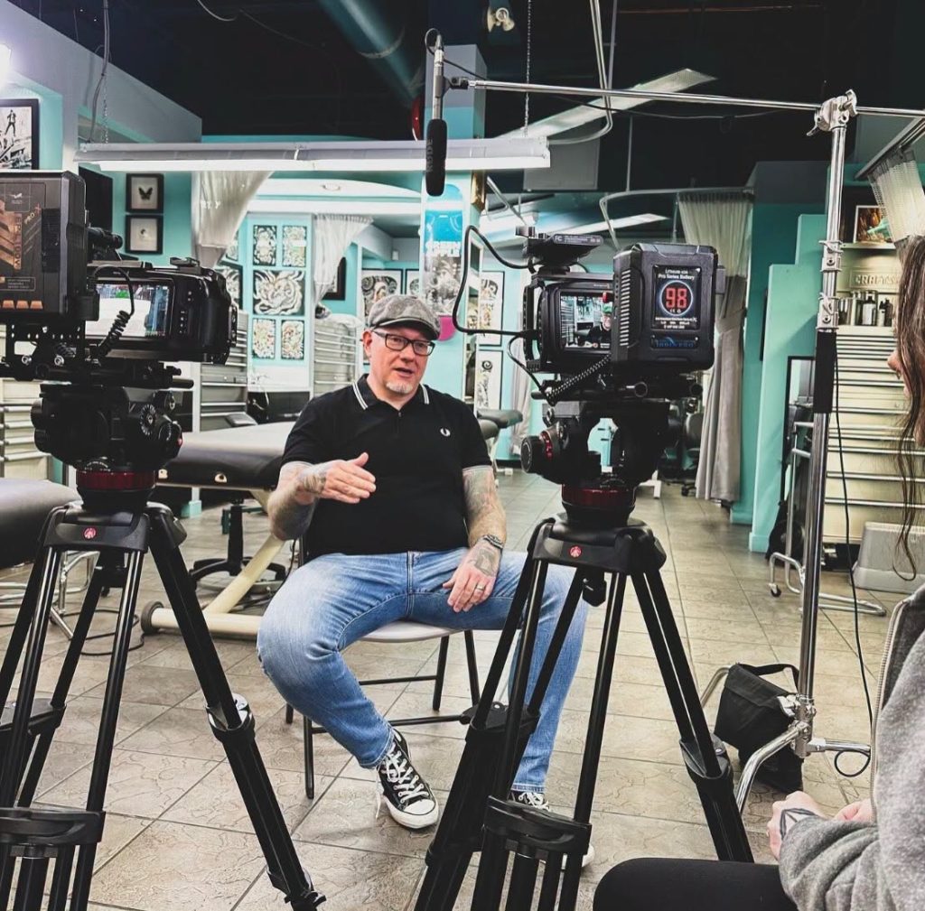 Brett Schwindt being filmed for an interview in the Strange World studio