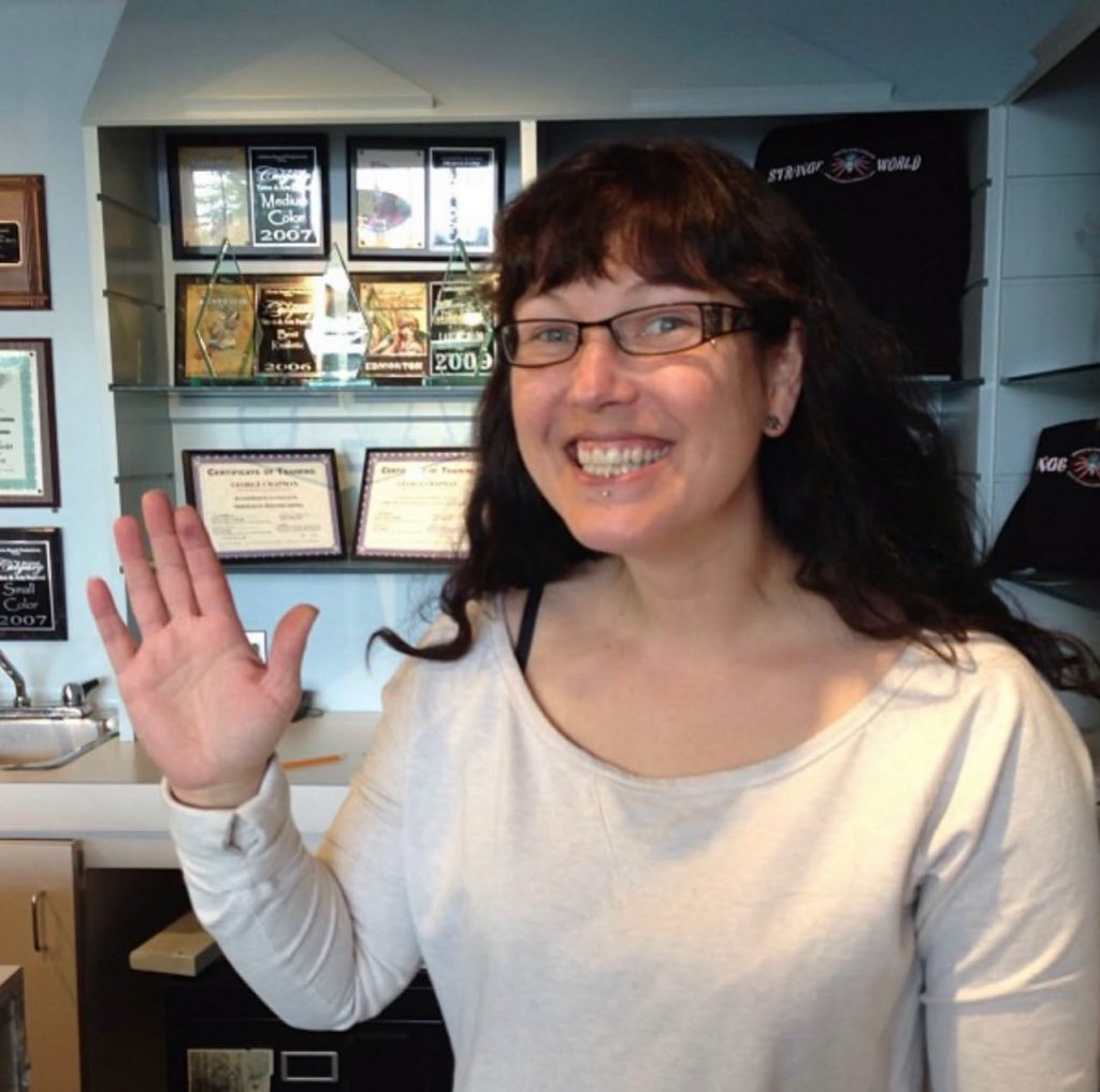 George Chapman waving in the Strange World Tattoo studio