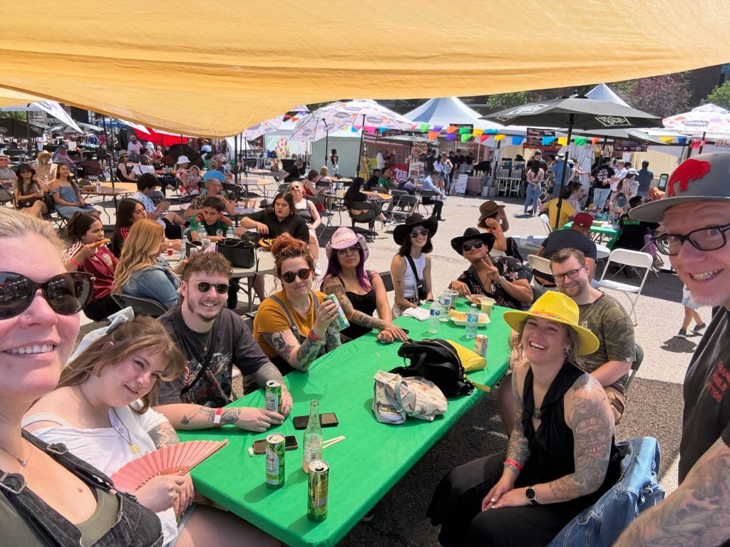 The Strange World crew out together at a long table