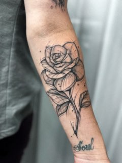 Fine line rose forearm tattoo by Valeriia Mosina