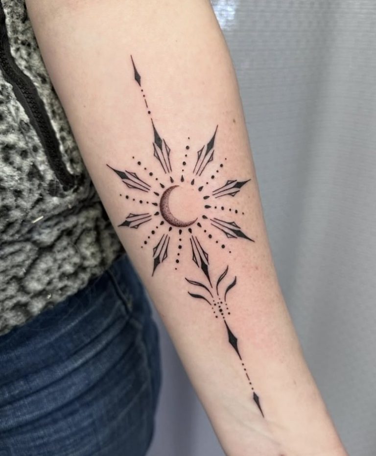 Fine line ornamental crescent moon and starburst tattooed on a forearm by Abi Rojas